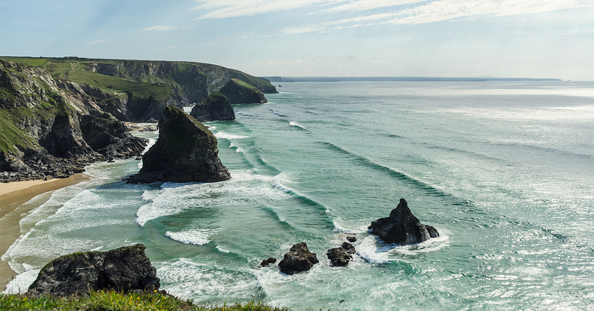 Dramatic Cornwall coastline with rugged cliffs and azure waters
